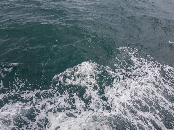 Surface of blue water Sea wave Colored background