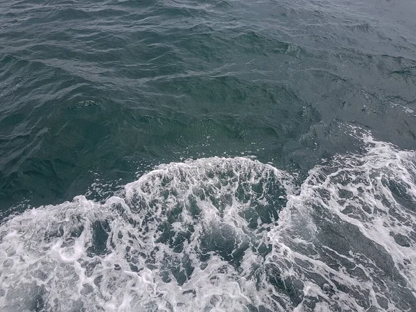 Surface of blue water Sea wave Colored background