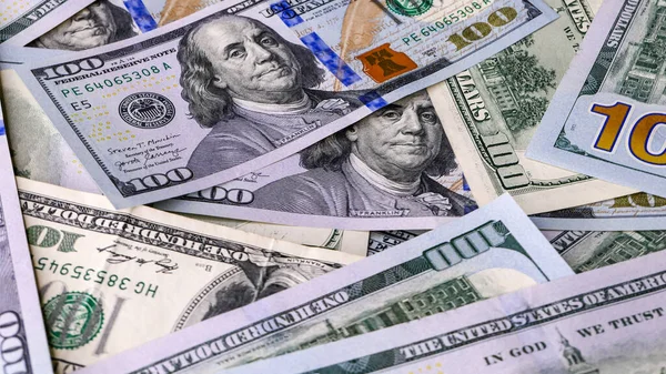 Background of US Currency banknotes Financial concept Money background Hundred dollar bills Top view Close up