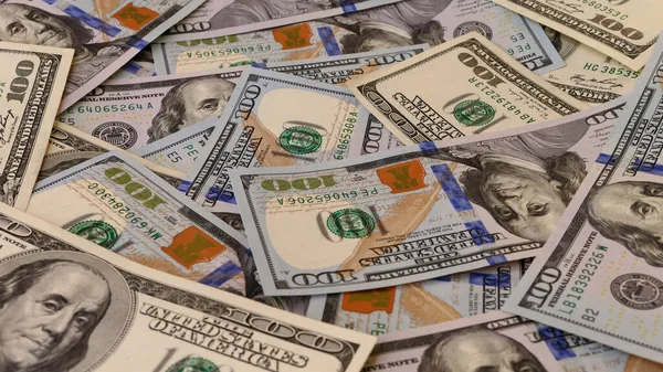 Background of US Currency banknotes Financial concept Money background Hundred dollar bills Top view Close up