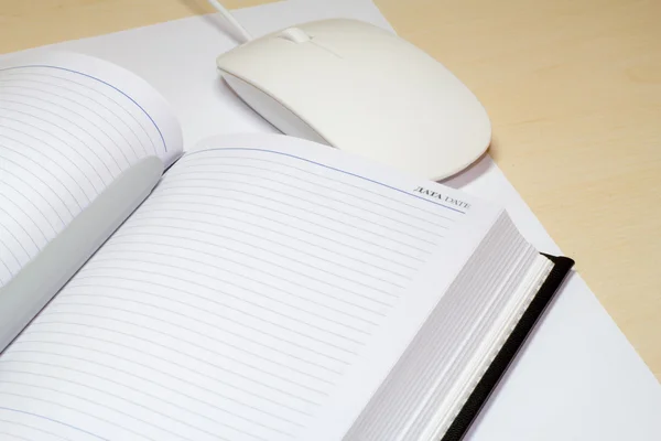 memo pad and a computer mouse