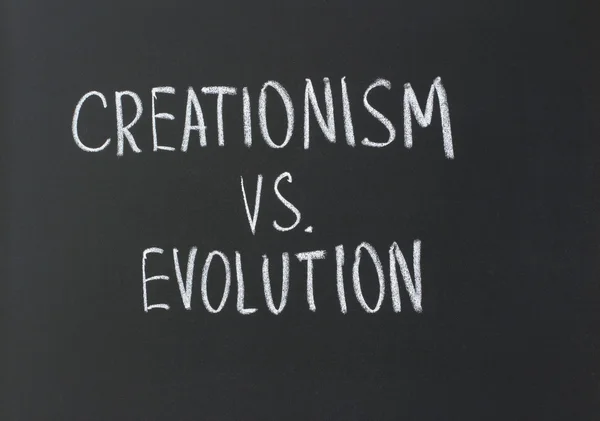 Kreacionismus versus evoluce — Stock fotografie