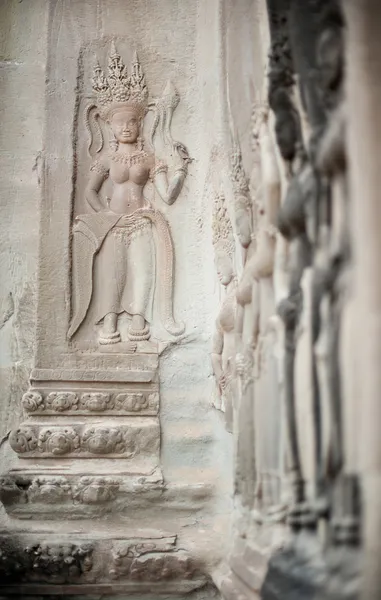 Figuras en la pared de uno de los templos de Angkor Imagen de archivo