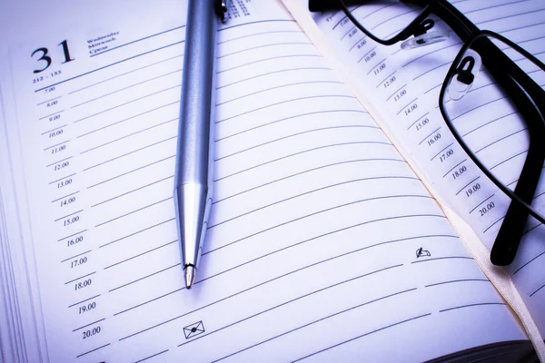 Address book, pen & black glasses — Stock Photo, Image