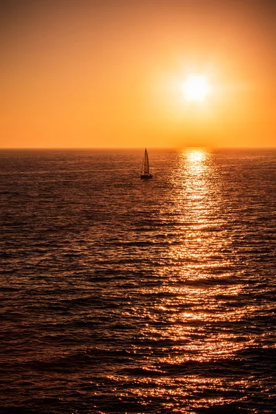 Sunset at the sea with boats — Stock Photo, Image