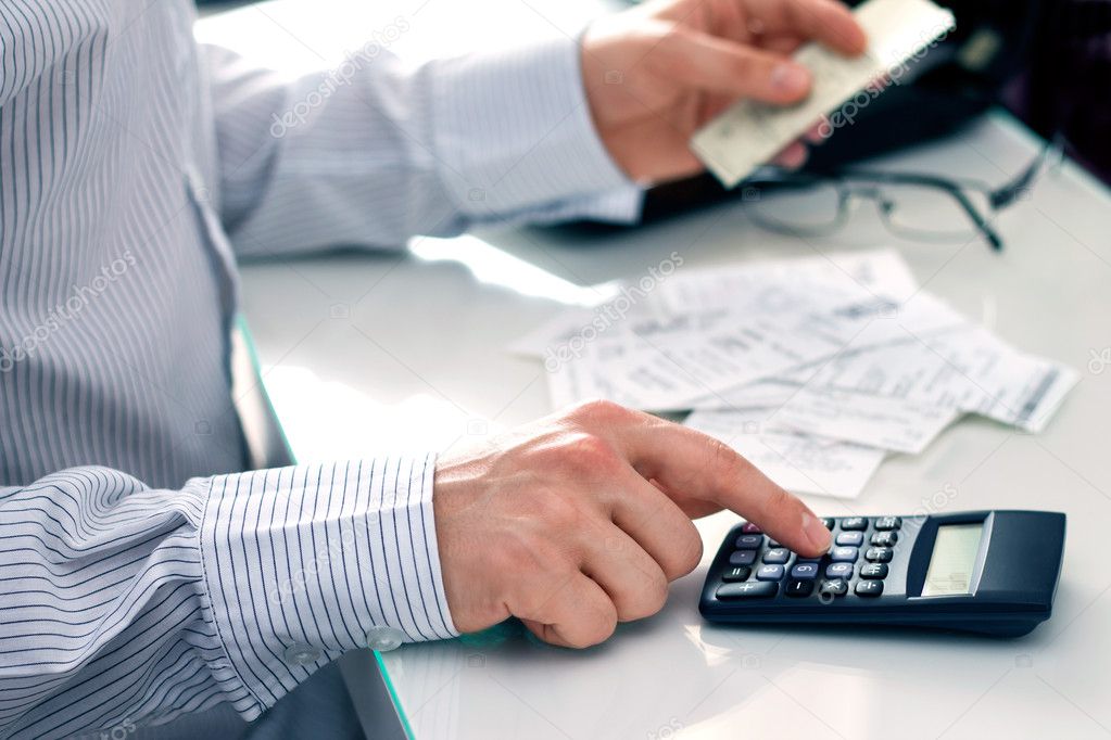 Businessman counting bills. Work in office