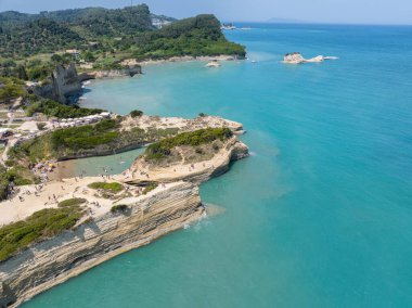 Aerial view of the promontory of Sidari in the northern part of the island of Corfu, Greece. Canal D'Amour cliffs. Bathers on the rocks and in the water