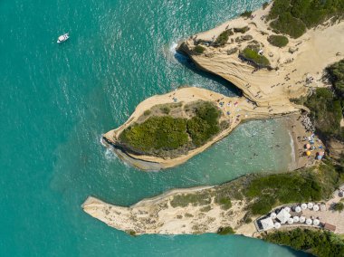 Aerial view of the promontory of Sidari in the northern part of the island of Corfu, Greece. Canal D'Amour cliffs. Bathers on the rocks and in the water