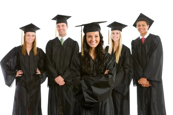 Graduation: Pretty Female Graduate with Others Behind Stock Photo