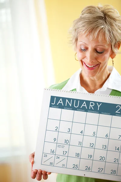 Pareja: Celebrando un calendario de enero — Foto de Stock