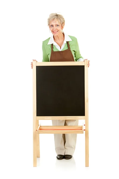 Shopkeeper: Standing with a Blank Chalkboard — Stock Photo, Image
