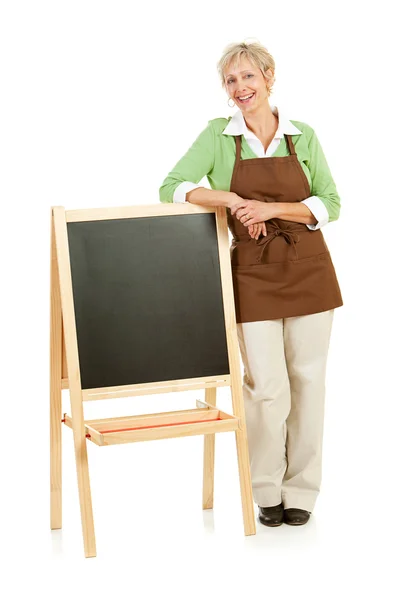 Shopkeeper: Standing with a Blank Chalkboard — Stock Photo, Image