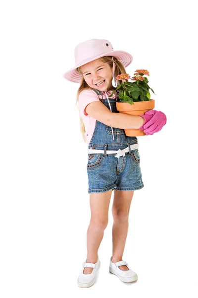 Jardinier : Petite fille tient la plante en pot — Photo