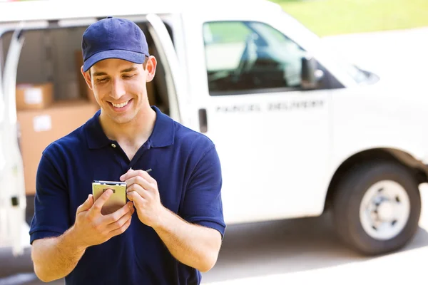 Delivery: Man Tracking Shipment with Van Behind — Stock Photo, Image