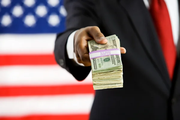 Politician: Holding Out a Stack of Money — Stock Photo, Image