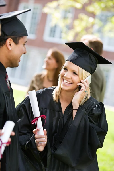 Graduation: Talking on the Phone to a Relative Stock Photo