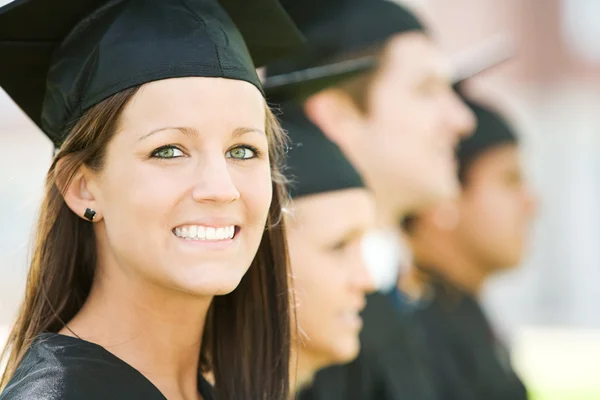 Graduation: Pretty Graduate Looks At Camera Stock Image