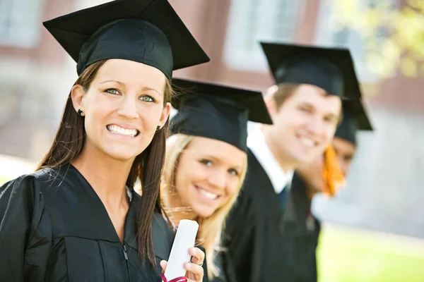 Graduation: Line of Graduates Look to Camera Royalty Free Stock Images