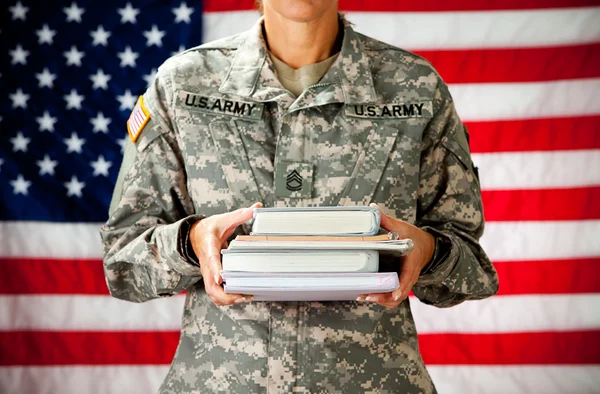 Soldier: Holding Stack of Text Books — Stock Photo, Image