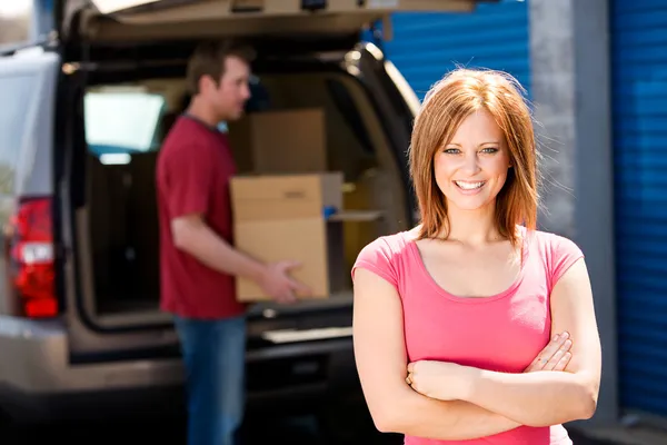 Storage: Woman with Truck Full of Boxes Royalty Free Stock Photos