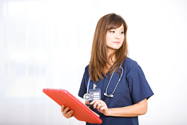 Nurse: Tired Nurse with Clipboard — Stock Photo, Image