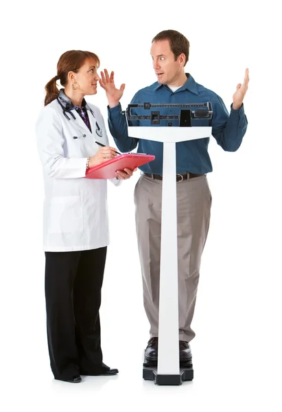 Lekarz: Człowiek zaskoczony przez przyrost masy ciała — Zdjęcie stockowe