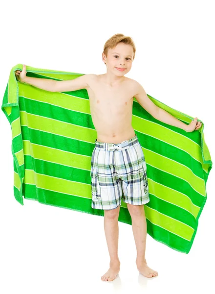 Κολυμβητής: Αγόρι που κρατά ψηλά την παραλία πετσέτα — Φωτογραφία Αρχείου