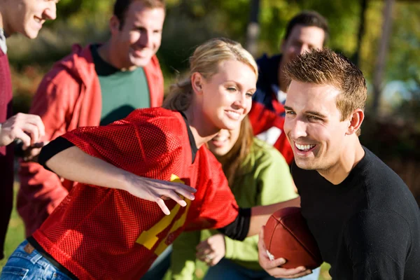 Football: Guy Runs with Ball Around Defense Royalty Free Stock Images