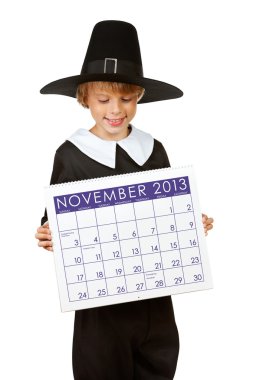 Thanksgiving: Pilgrim Holding Calendar for 2013 clipart