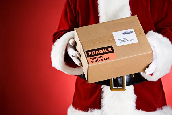 Santa: Holding A Package Ready For Shipping — Stock Photo, Image