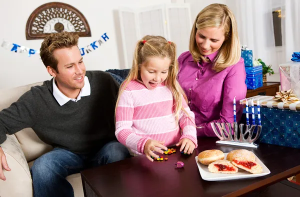 Hanukkah: Little Girl Wins Dreidel Game Stock Photo