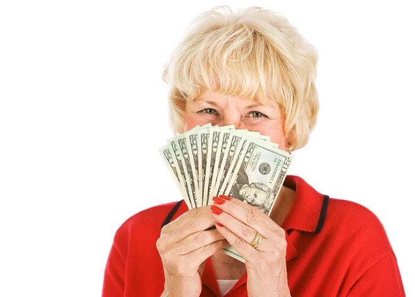 Seniorer: kvinnan håller upp pengar fan — Stockfoto