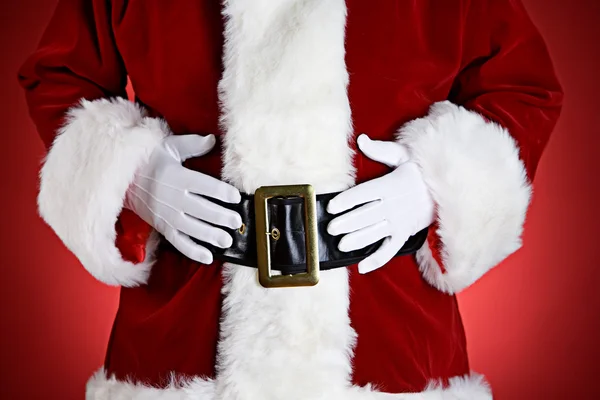 Santa: santa med händerna på magen — Stockfoto