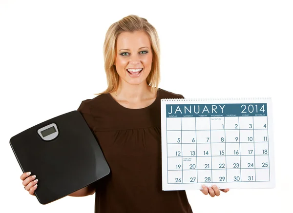 2014 kalender: kvinna upphetsad kost i januari — Stockfoto