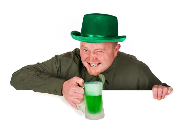 Leprechaun: Holding Green Beer Over White Card Stock Image