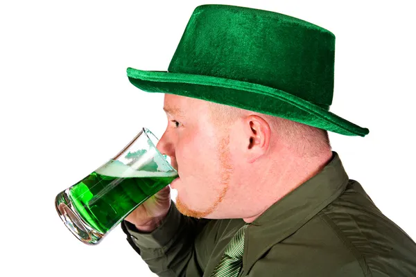 Leprechaun: Man Drinking Green Beer Stock Photo