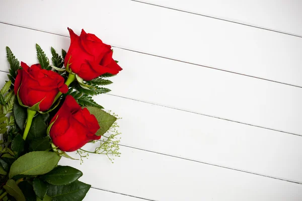 Valentine's: Red Roses on White Wood Background Stock Photo