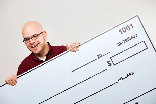 Check: Cheerful Man with Large Check — Stock Photo, Image