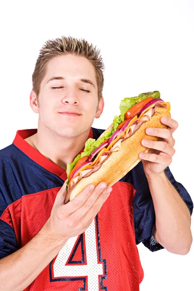 Voetbal: man klaar om te eten heerlijke sandwich — Stockfoto