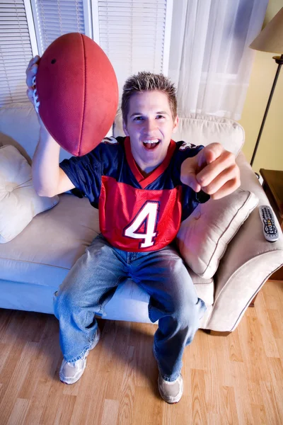 Football: Fan On Couch Cheers For Team — Stock Photo, Image