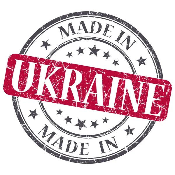 Hergestellt in der Ukraine roter Grunge-Stempel isoliert auf weißem Hintergrund — Stockfoto