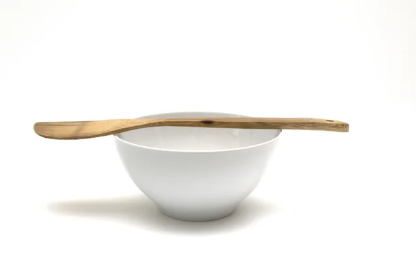 Bowl with wooden spoon — Stock Photo, Image