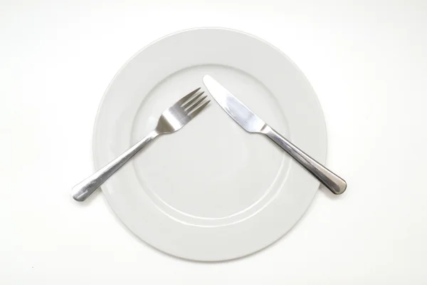 Dinner plate with cutlery — Stock Photo, Image