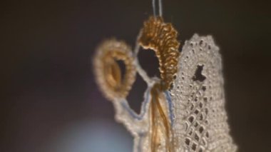 Angel Christmas tree toy, embroidered from lace in a backlight