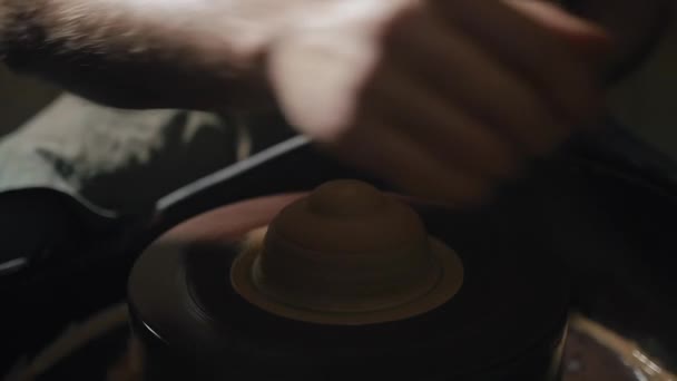 Artisan hands shaping clay on a potters wheel in slow motion — Stock Video