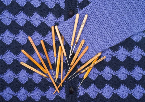 Knitwear and crochet hooks — Stock Photo, Image