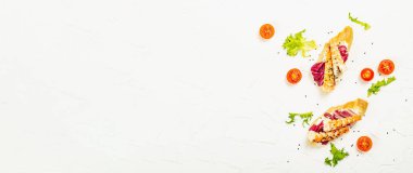 Open sandwiches with boiled shrimps, cream cheese, salad leaves and cherry tomatoes. Seafood, healthy food. White putty background, creative flat lay, banner format