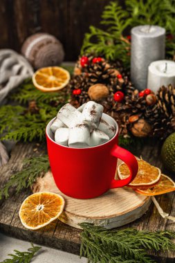 Hot cocoa or chocolate with marshmallows. Christmas traditional decor, New Year festive arrangement. The concept of coziness, wooden background