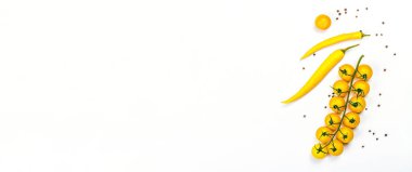 Yellow tomatoes cherry and chili pepper isolated on white background. Traditional ingredient for cooking healthy food, mockup, template, banner format