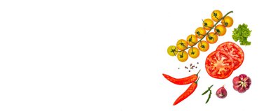 Assorted fresh vegetables and spices isolated on white background. Ripe tomato slices, purple onion, lettuce and chili pepper. Traditional ingredients for cooking healthy food, banner format